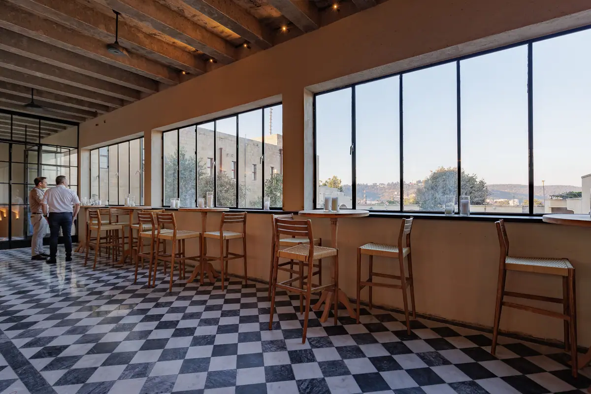 The long gallery with windows to the hills