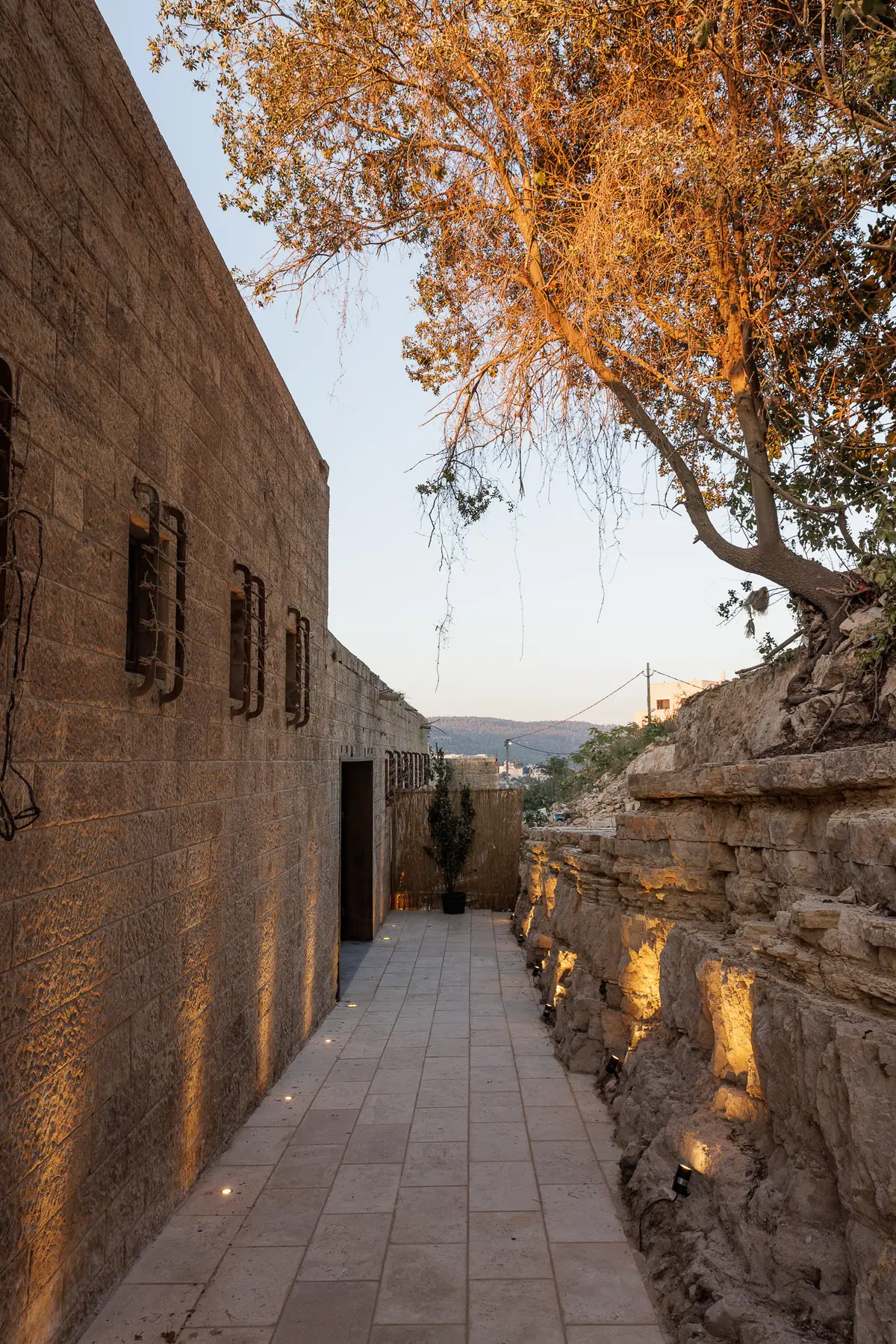 Stone, quiet, and a path that leads you in.