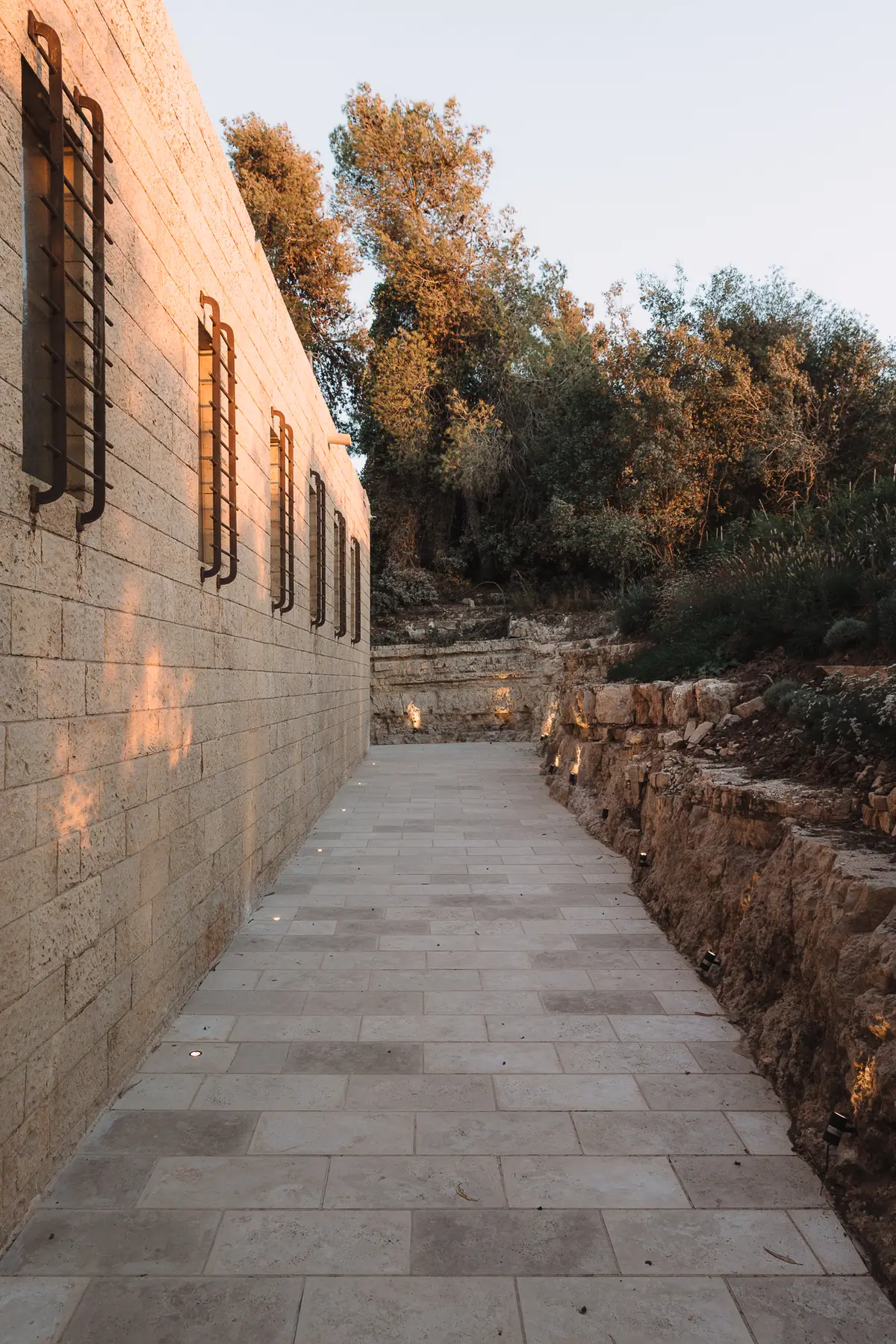 The stone path along the wall in soft light